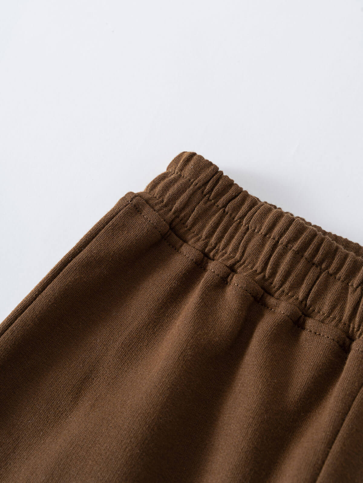 Close-up of brown sweatpants waistband with elastic gathering detail Cargo Sweatpants - Spruce Boys