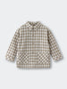 Plaid shirt with long sleeves on a light gray background