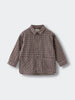Plaid shirt on a light gray background