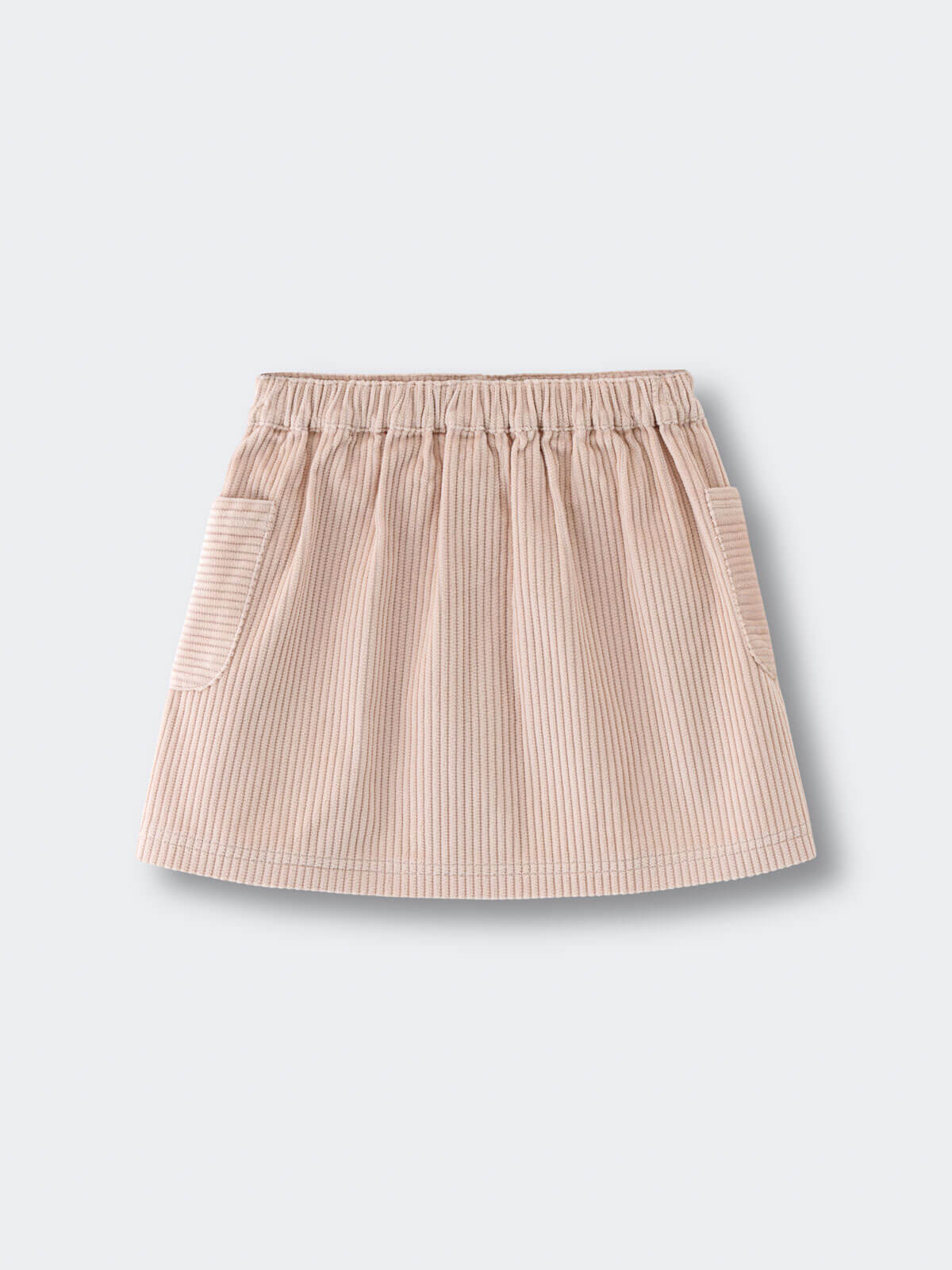 Beige corduroy skirt on a light gray background