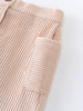 Close-up of a beige corduroy skirt on a white background