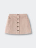 Beige corduroy skirt with button details on a light gray background