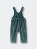 Green corduroy overalls on a white background