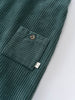 Green corduroy overalls  with a pocket on a light gray background