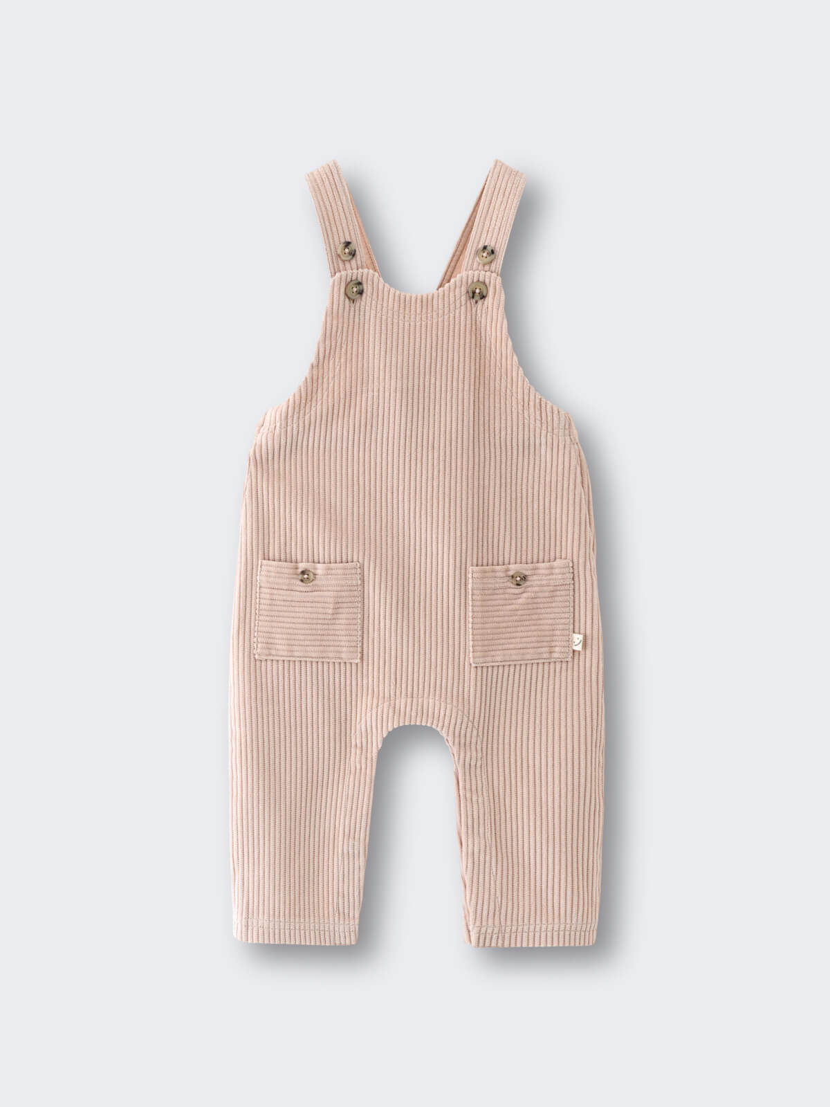 Beige corduroy overalls on a light gray background