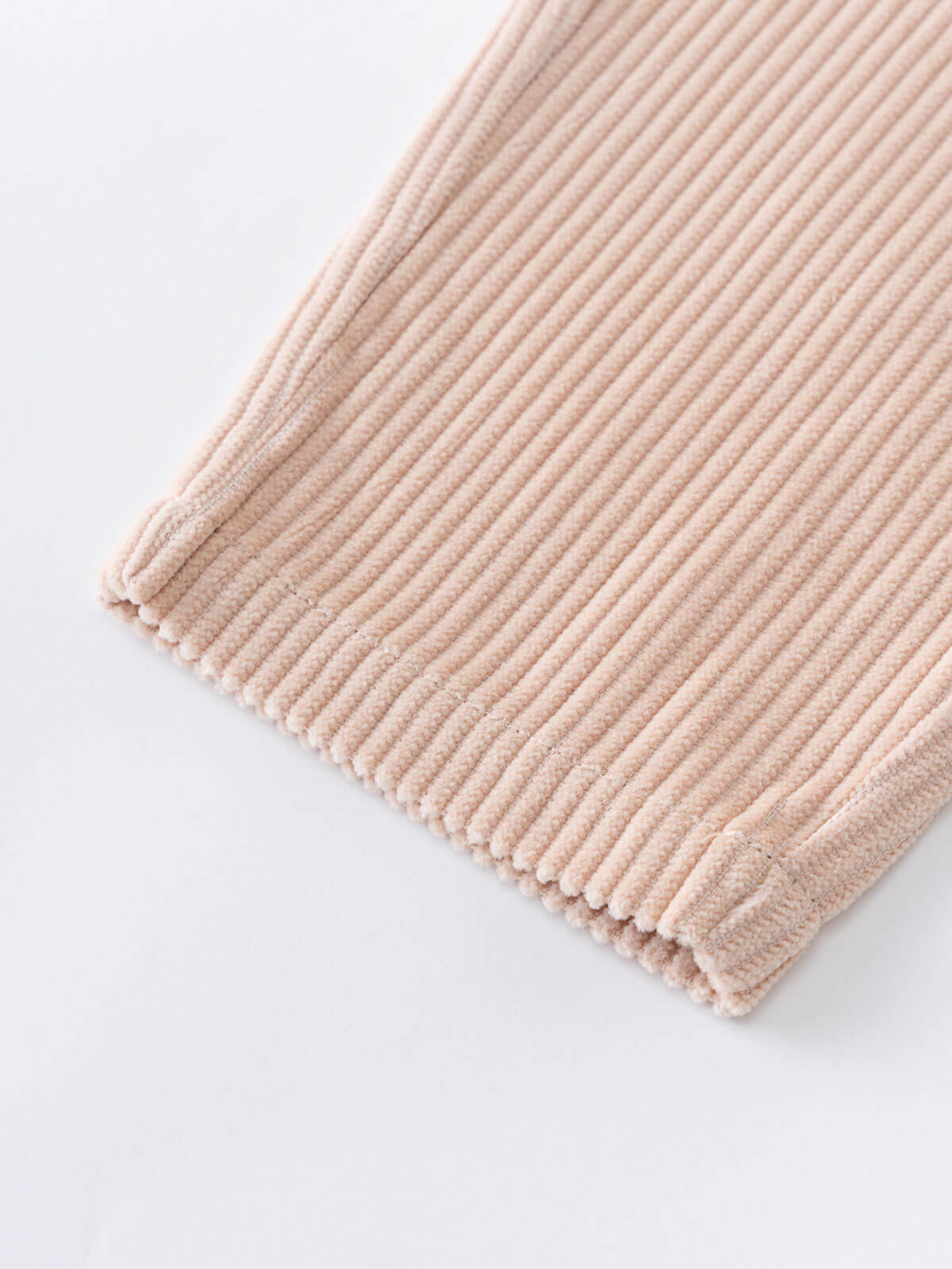 Beige corduroy pants on a light gray background  Corduroy Pants - Clay Girls and Boys