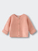 Pink knitted baby cardigan with buttons laid flat on white background Cotton Cardigan - Toasted Peach Baby girl