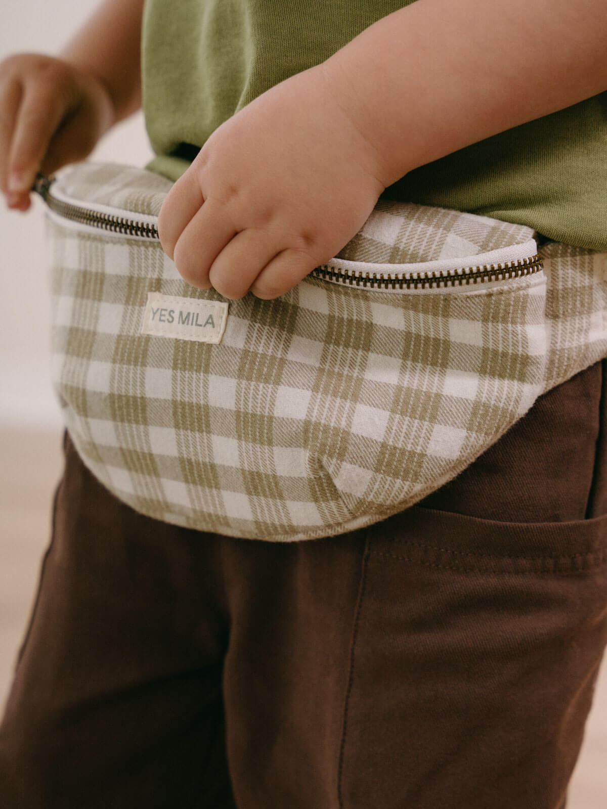 Child holding a plaid fanny pack with 'YES MILA' label Crossbody Bag - Brushed Cotton Check Girls and Boys