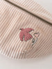 Pink corduroy waist bag with pink embroidered design on a light background Crossbody Bag - Dove Girls