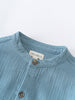Close-up of a blue garment with a visible brand label on a white background Grandad Shirt - Lake Blue Boys
