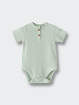 Light green ribbed baby bodysuit with two brown buttons at the neckline Henley Short Sleeve Bodysuit - Matcha Baby boy