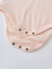 Close-up of pink ribbed fabric bodysuit with metal snap buttons Henley Short Sleeve Bodysuit- Shell Pink Baby girl