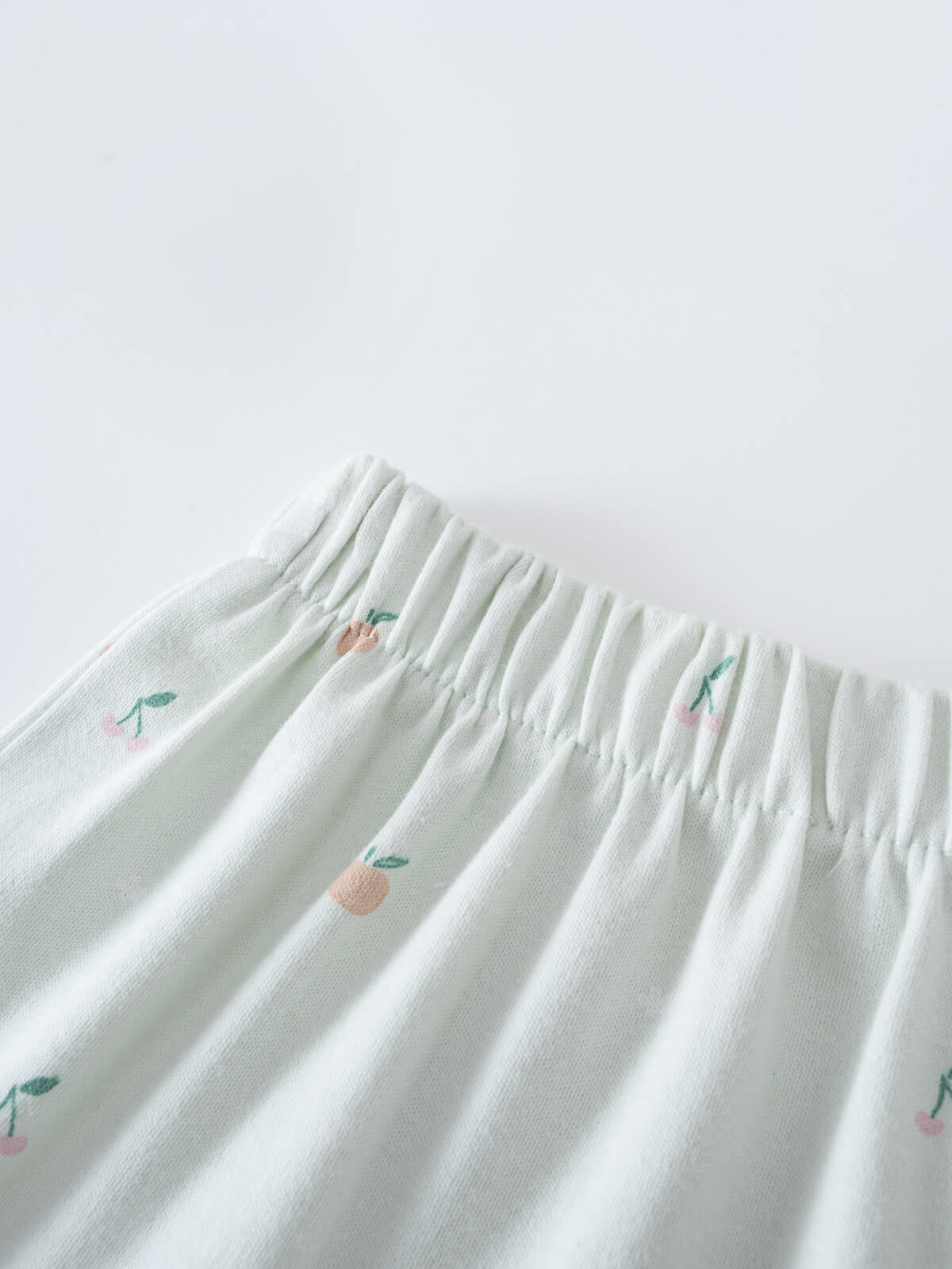 Close-up of white gathered skirt waistband with small embroidered fruit pattern Jersey Skirt - Summer Fruits Girls