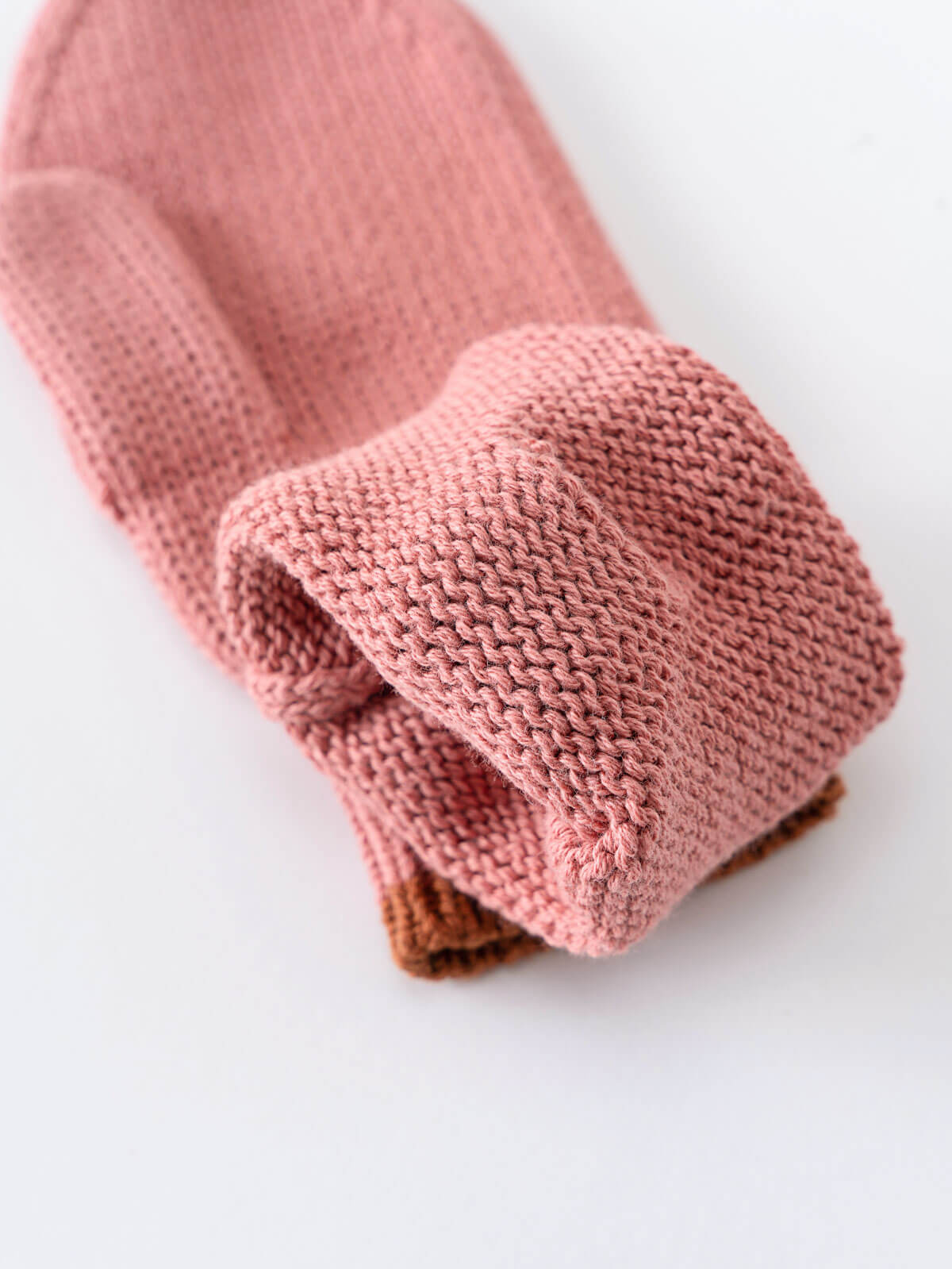 Pink knitted mittens on a white background Knit Mittens - Rosehip Girls