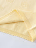 Close-up of pale yellow knit fabric with eyelet detail and fringe trim Knit Tee - Sun Soaked Girls