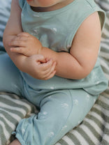 Baby in light blue outfit sitting on a striped surface Leo Romper - Summer Time Baby boy