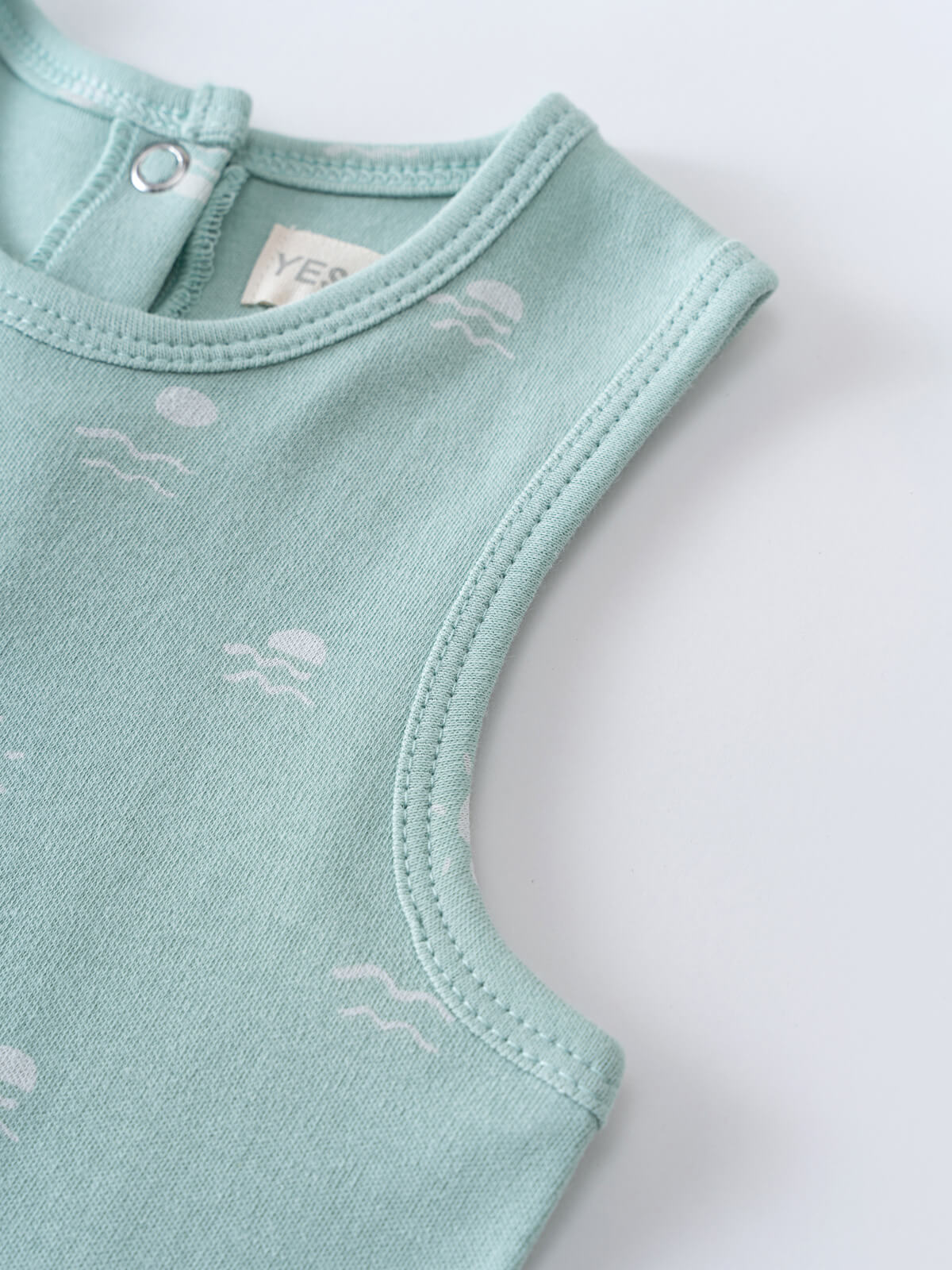Close-up of a light blue baby romper with white fish print Leo Romper - Summer Time Baby boy