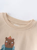 Close-up of beige sweatshirt neckline with bear illustration wearing blue jacket Feature Print Sweatshirt - Hiking Bear Baby boy
