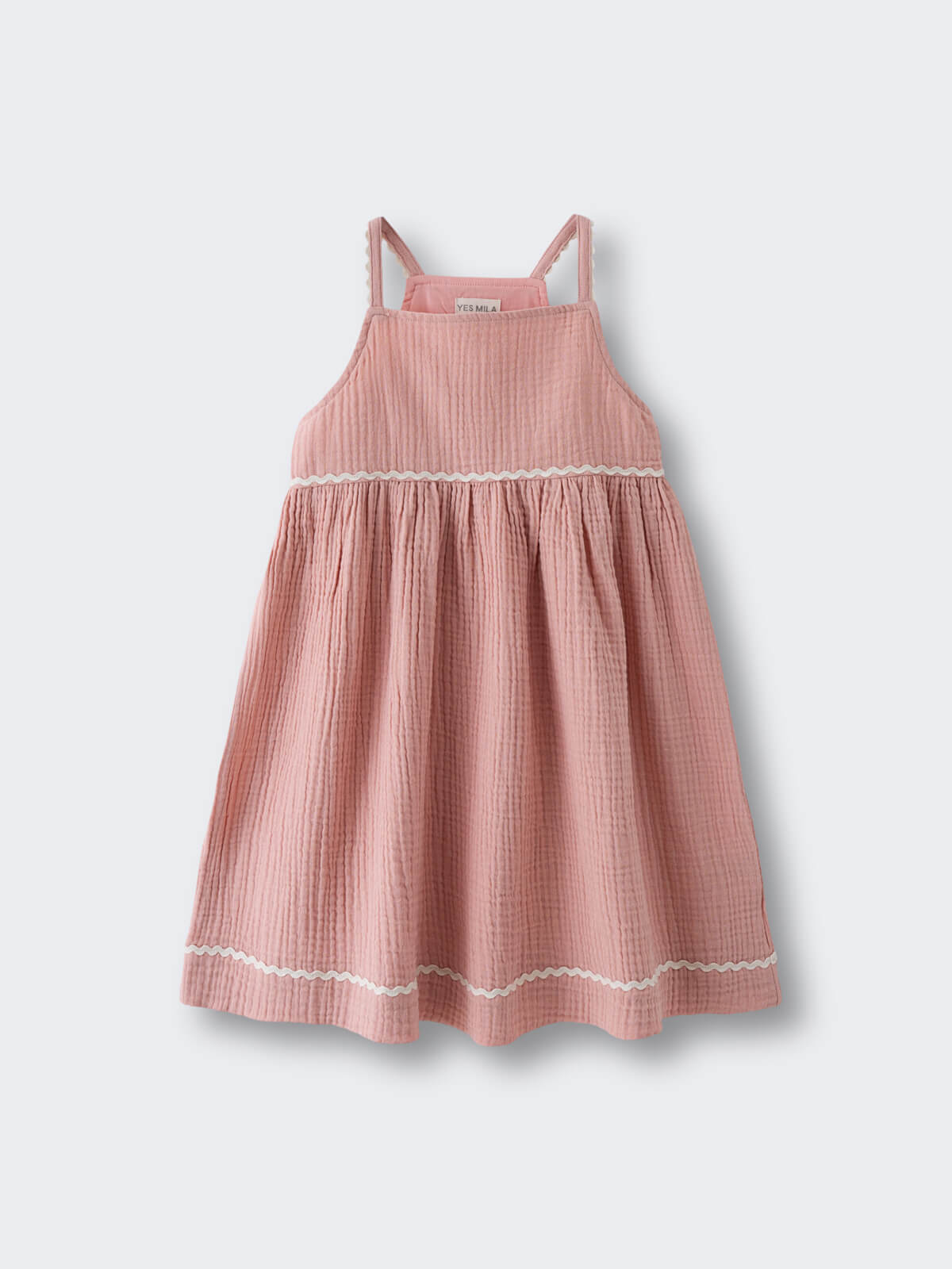 Pink corduroy dress with white trim detail and gathered straps Muslin Dress - Toasted Peach Girls