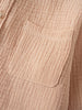 Close-up of a textured beige fabric shirt showing a pocket detail Muslin Long Sleeve Shirt - Sand Boys