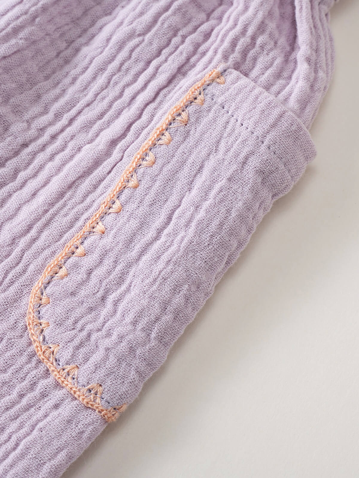 Close-up of lilac ribbed shorts with peach blanket stitch edging detail Muslin Shorts - Lilac Girls
