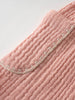 Close-up of pink textured fabric shorts with cream crochet trim detail Muslin Shorts - Toasted Peach Girls