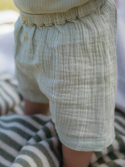 Close-up of light-colored shorts with a blurred background