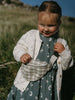 Child holding a small bag in a grassy outdoor setting Crossbody Bag - Brushed Cotton Check Girls and Boys