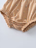 Close-up of beige fabric bloomers with small floral print and elastic gathering Printed Bloomers - Floral Bloom Baby girl