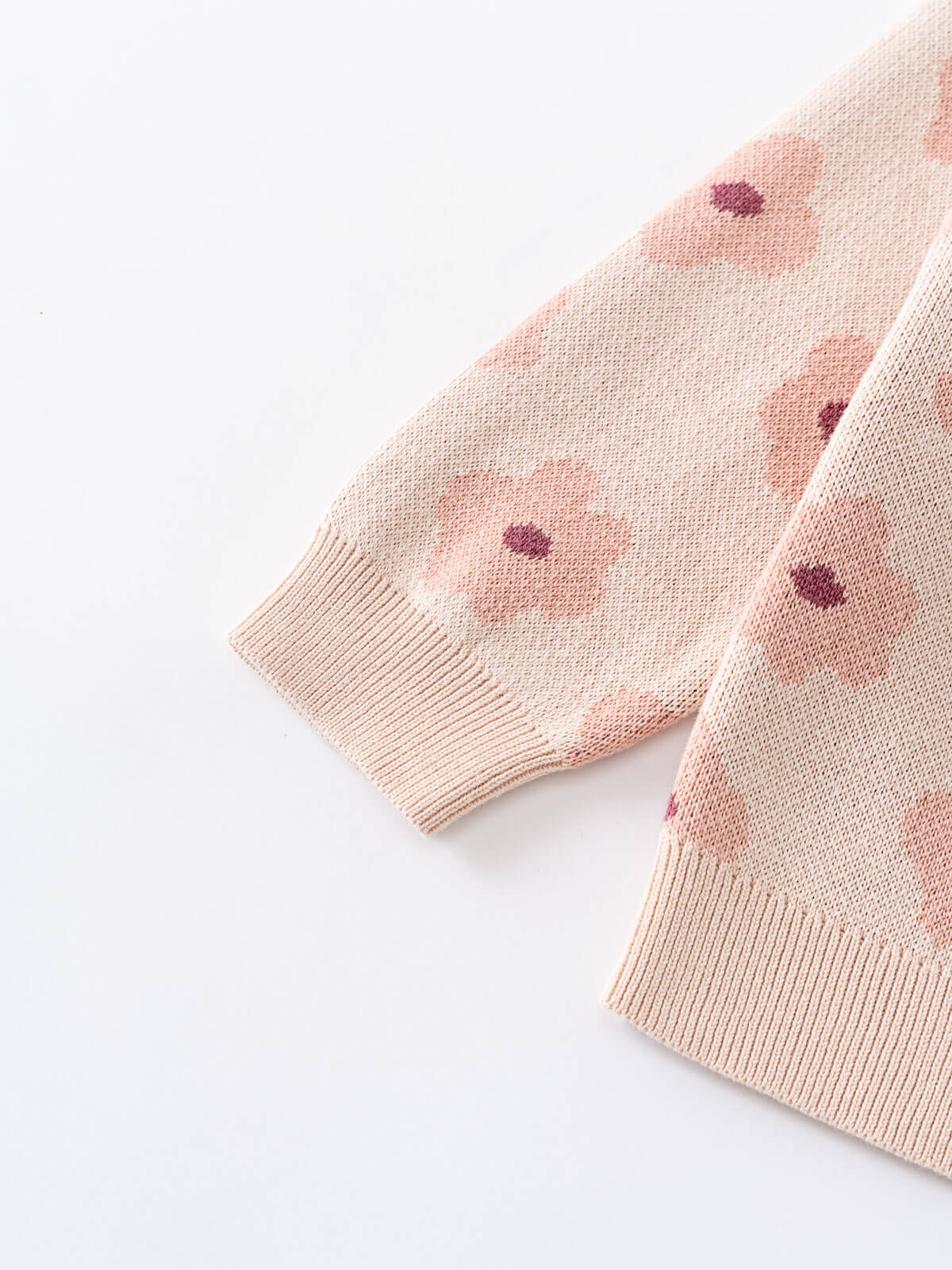 Pink knitted fabric with floral pattern on a white background Printed Cardigan - Bold Daisy Girls