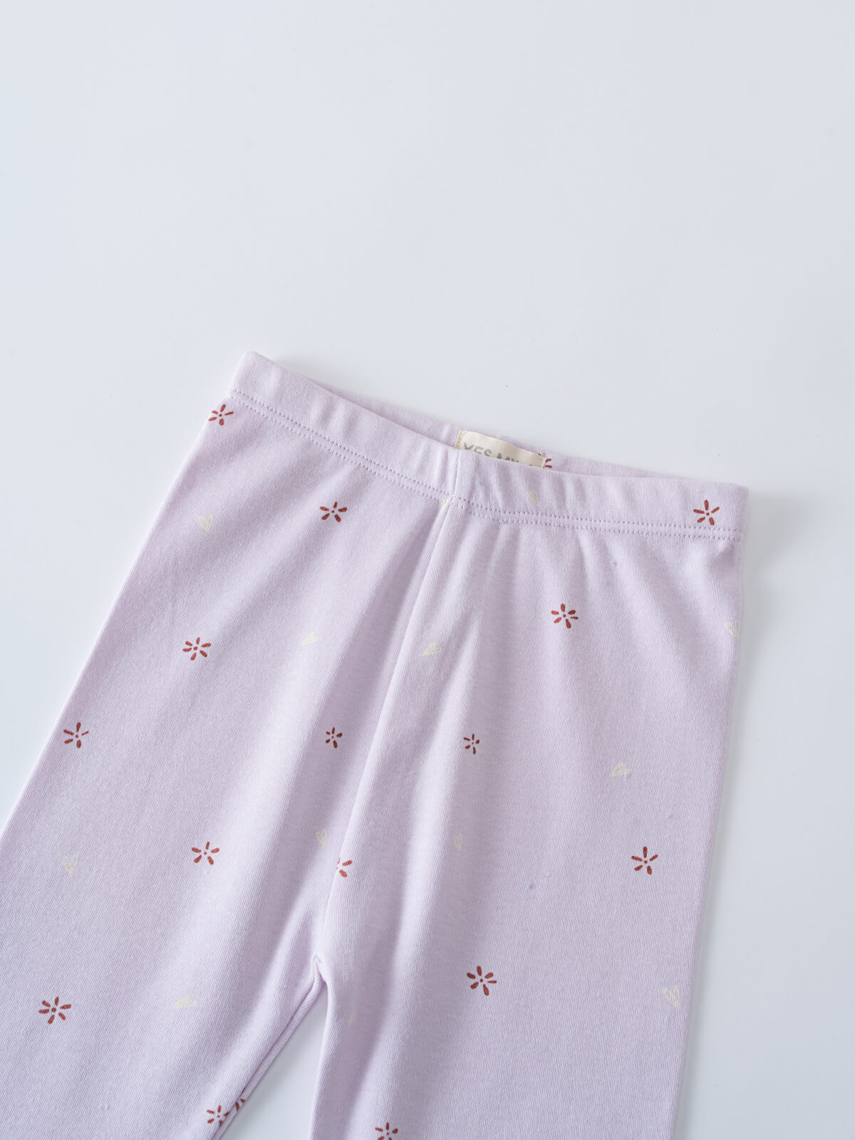 Light purple leggings with small red floral embroidery pattern throughout printed Leggings - Spring Love Girls