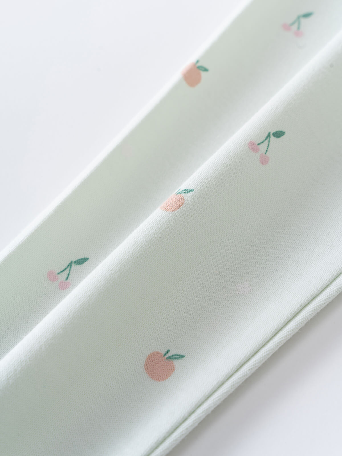 Light green fabric with small pink cherries and peaches print Leggings - Summer Fruits Girls