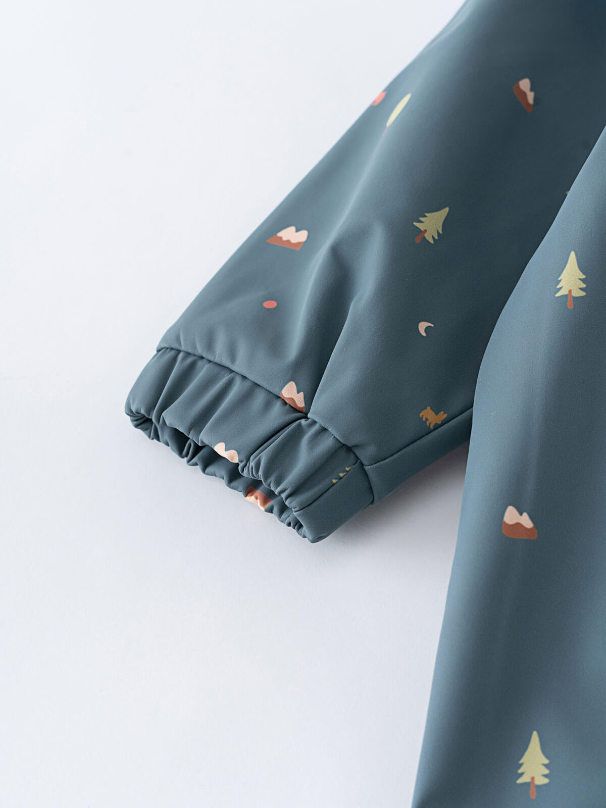 Blue baby rain suit with colorful patterns on a light gray background Printed Puddle Suit - Mountain View Balsam Baby girl