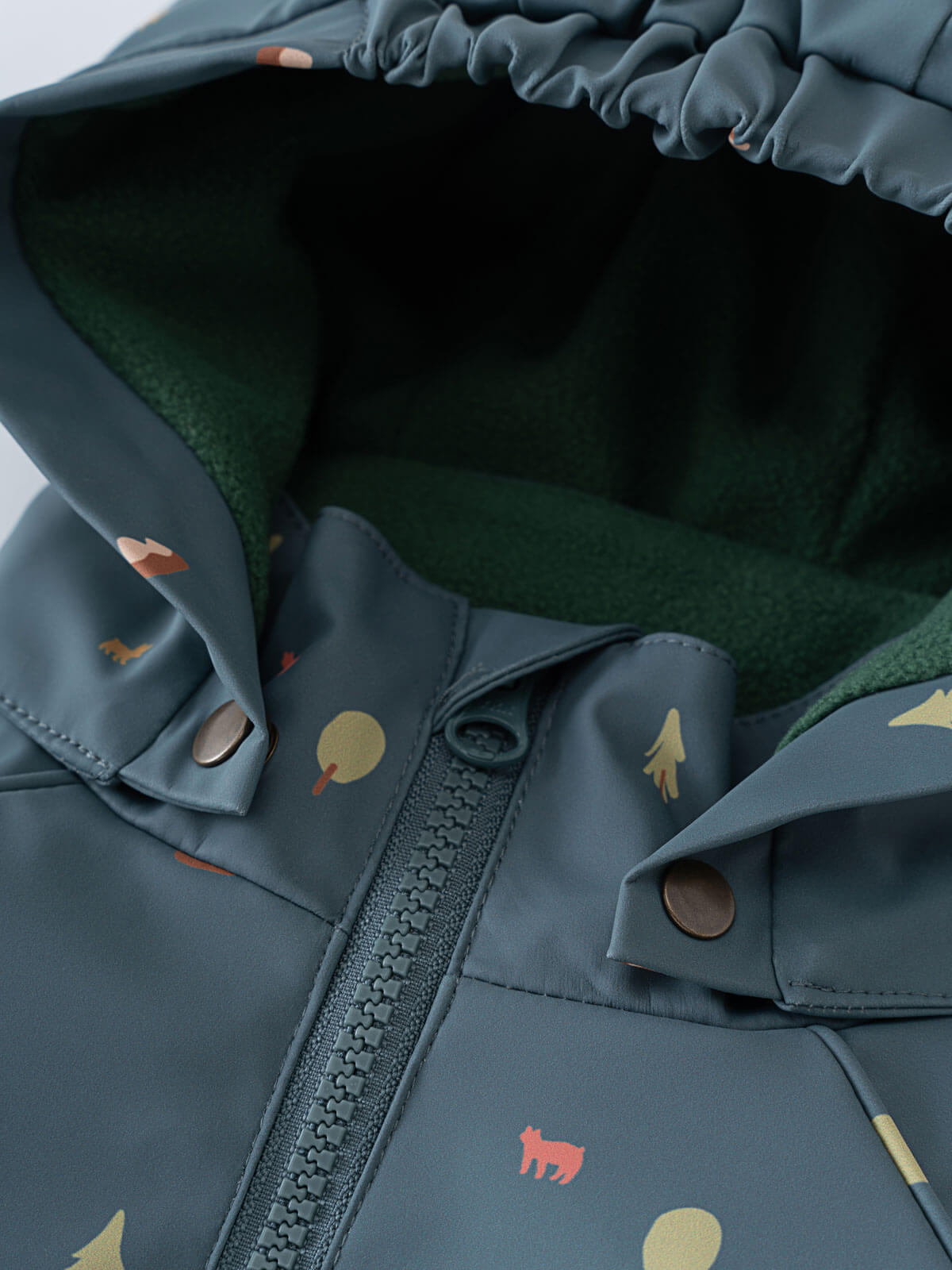 Close-up of a blue jacket with patterned design on a white background Printed Puddle Suit - Mountain View Balsam Baby girl
