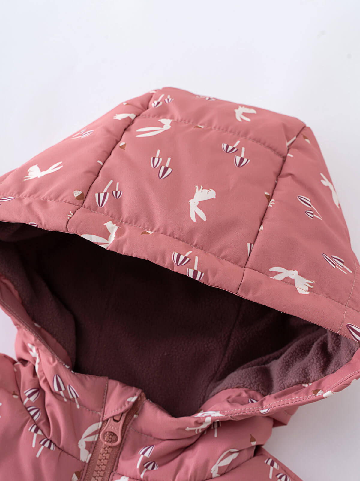 Pink puffer vest with bird pattern shown unzipped revealing dark fleece lining Printed Puffer Vest Jacket - Forest Gathering Rosehip Girls