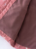 Close-up of pink patterned fabric trim on dusty rose textured material Printed Puffer Vest Jacket - Forest Gathering Rosehip Girls