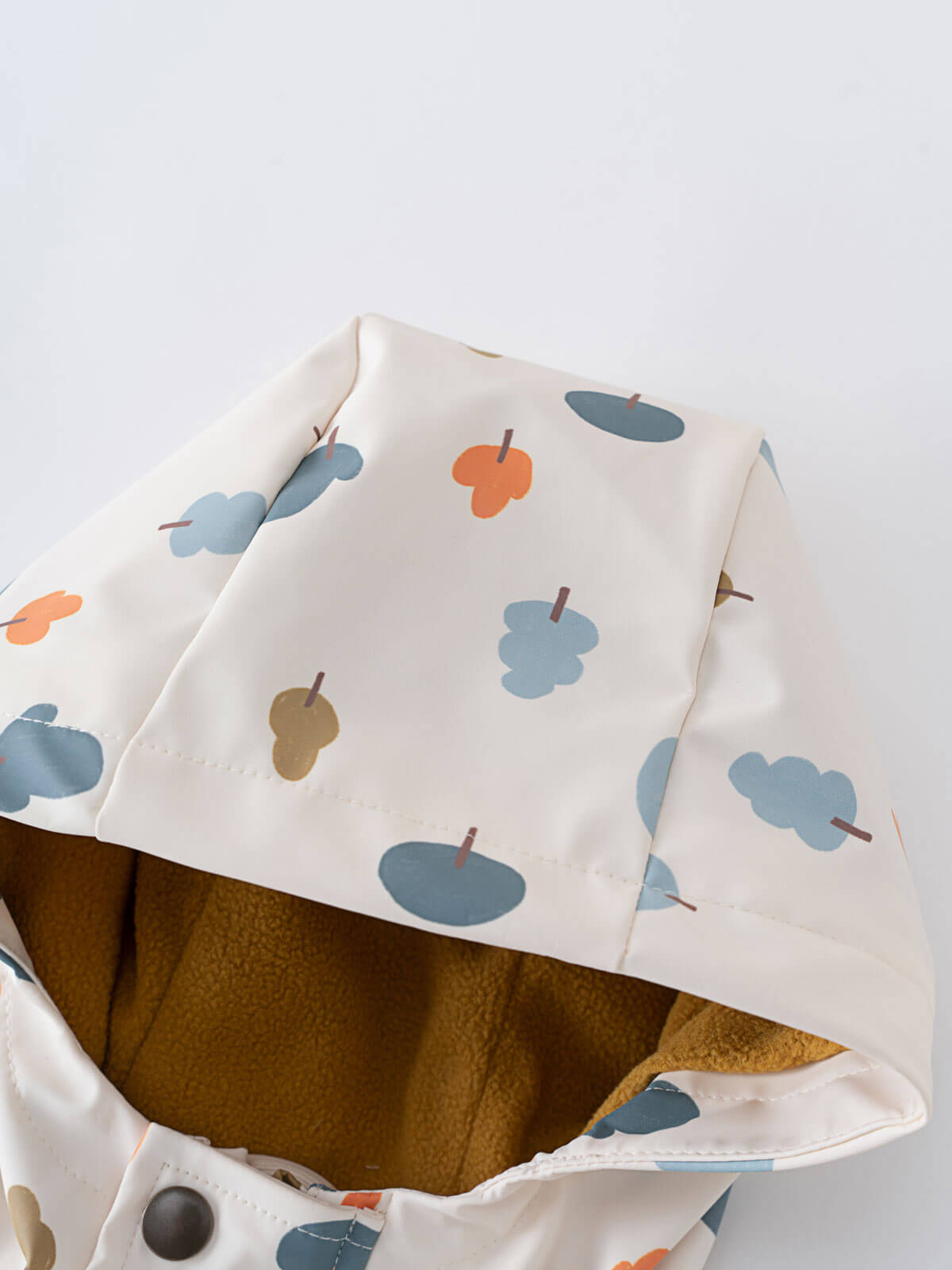 White fabric with colorful cloud-like print and brown fleece lining visible inside Printed Raincoat - Forest Adventure Ecru Boys