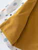 Mustard yellow fleece blanket next to printed white raincoat with zipper detail Printed Raincoat - Forest Adventure Ecru Boys