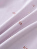 Close-up of light purple fabric with small red floral embroidered details printed Short Sleeve Tee Shirt - Spring Love Girls
