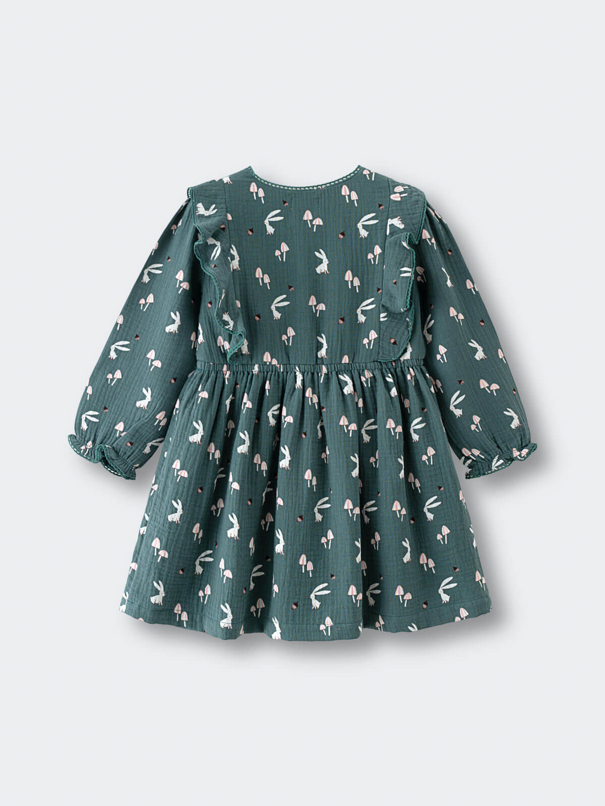 Green dress with bunny print on a light gray background