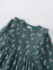 Green dress with bunny print on a white background