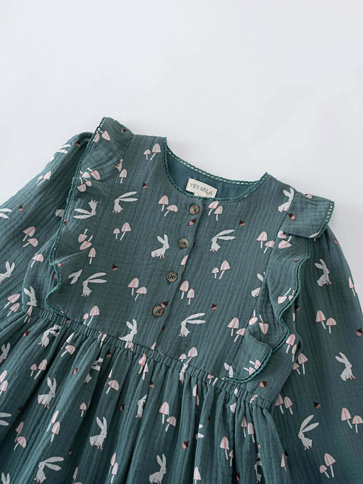 Green dress with bunny print on a white background