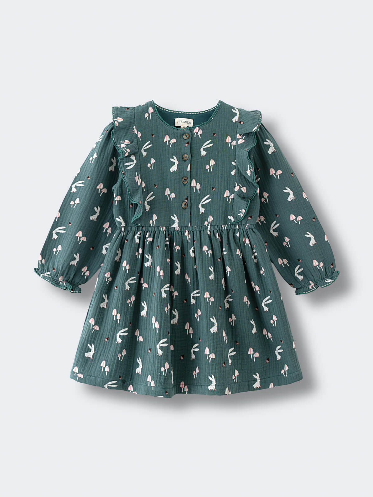 Green dress with animal pattern on a light gray background