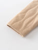 Close-up of beige fabric with a textured pattern on a white background Quilted Jacket - Clay Baby girl
