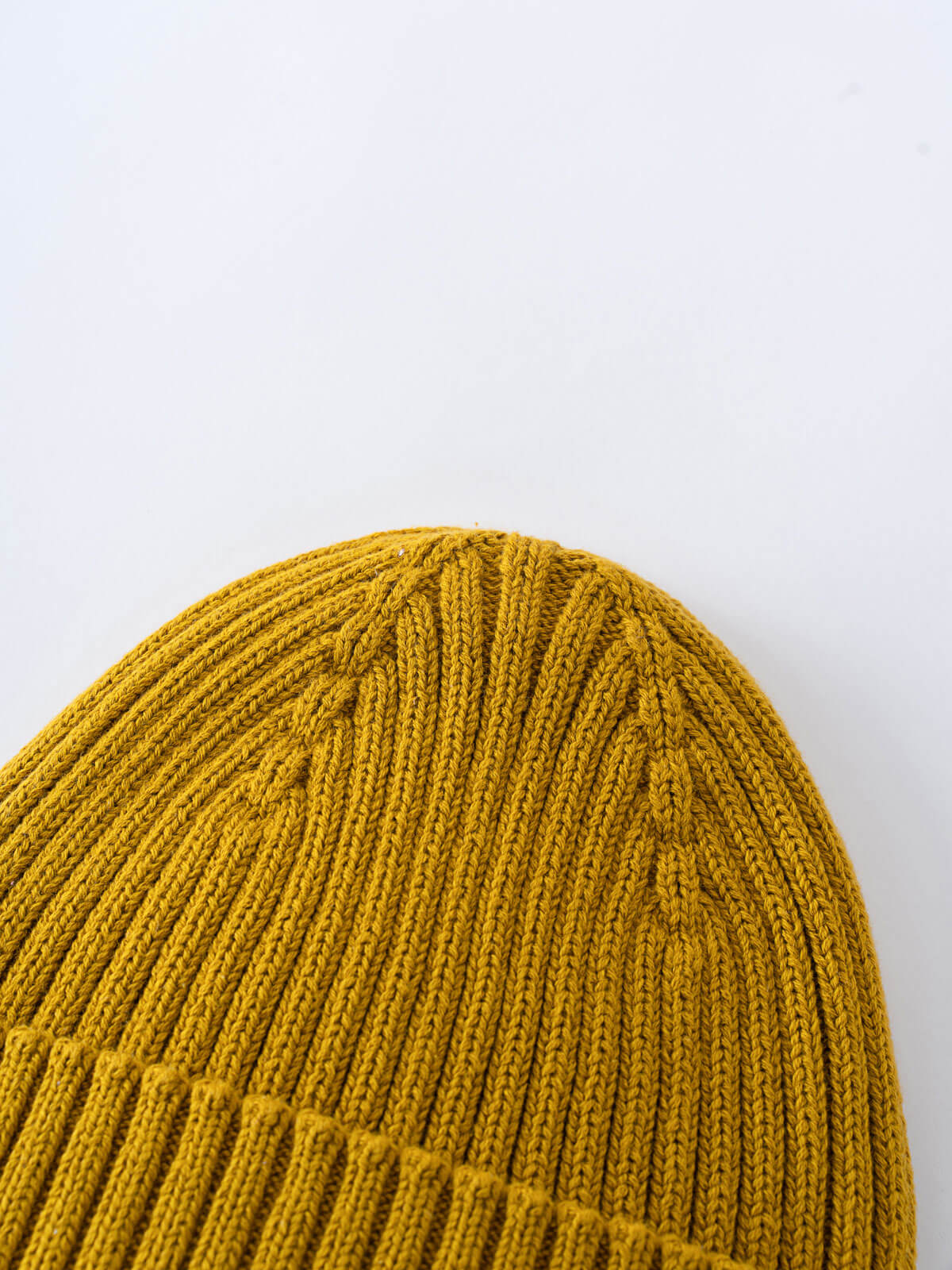 Gold knit beanie on a light gray background Ribbed Beanie - Golden Pear Boys