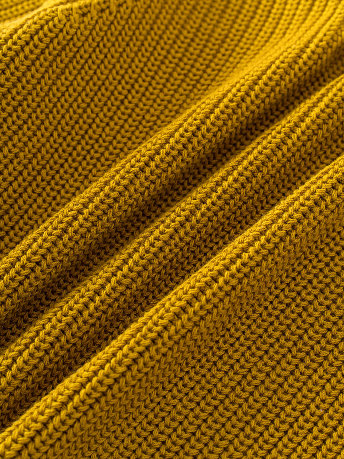 Close-up of golden fabric with a textured pattern Ribbed Jumper - Golden Pear Boys