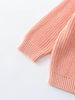 Close-up of a pink knitted garment on a light gray background Ribbed Jumper - Mallow Girls