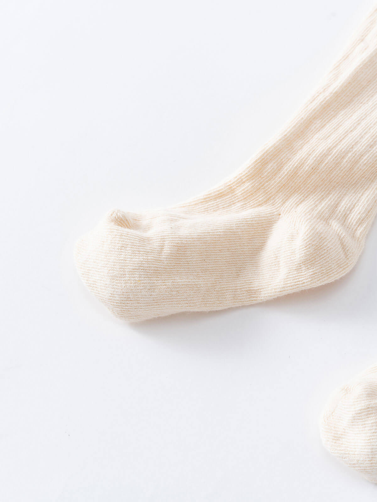 Close-up of cream ribbed tights showing foot and leg detail Ribbed Tights 2 Pack - Golden Pear/Ecru Girls