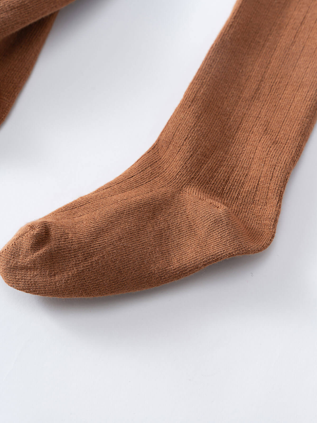 Close-up of brown ribbed knit tights on white surface Ribbed Tights 2 Pack - Rosehip/Russet Girls