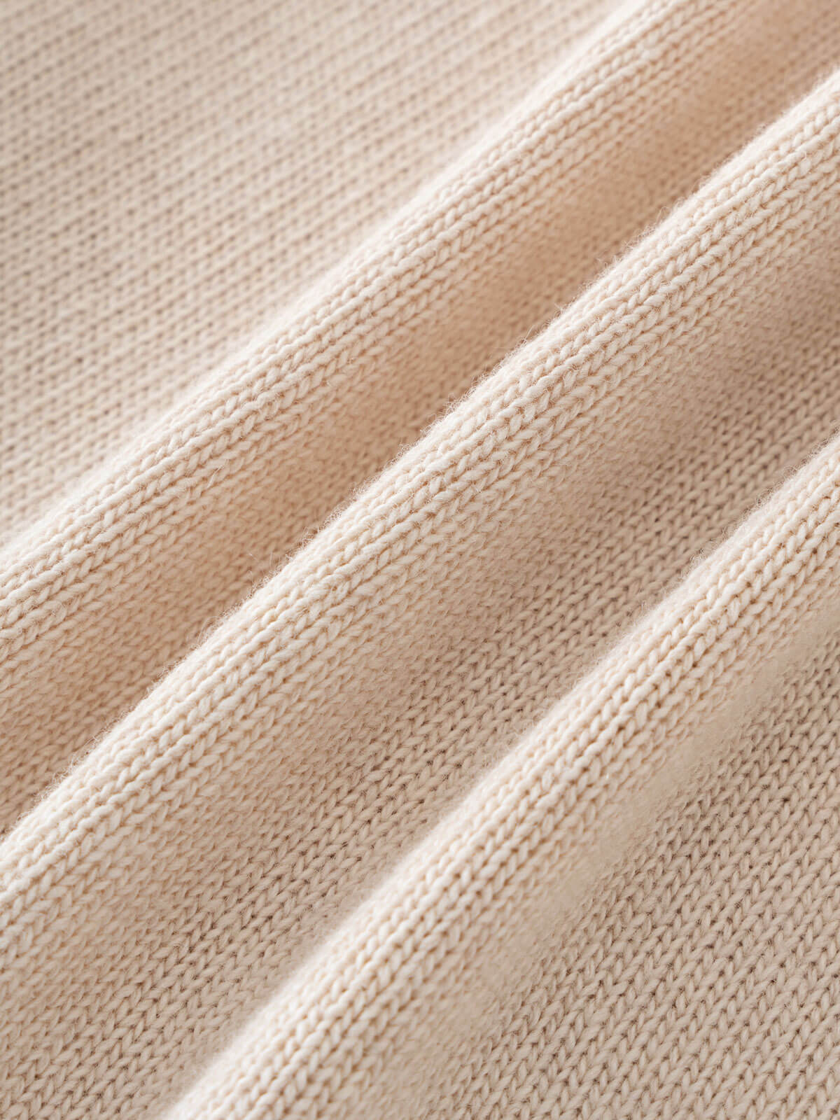 Close-up of beige fabric with a subtle pattern Ruffle Cardigan - Ecru Girls